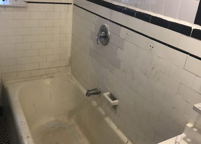 Worn out bathtub and tile paint
