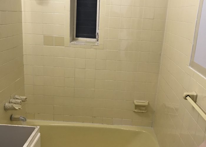 Yellow bathtub and tiles